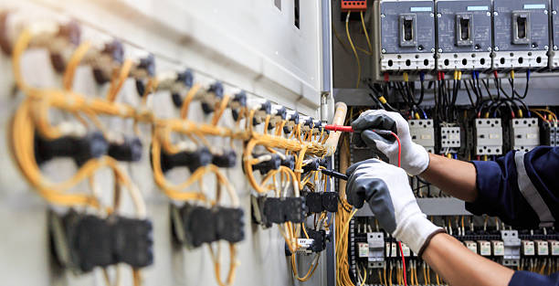 Professional Electrician technician working in Roosevelt Gardens, FL